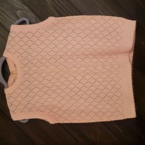 Crocheted pink vest zips up back